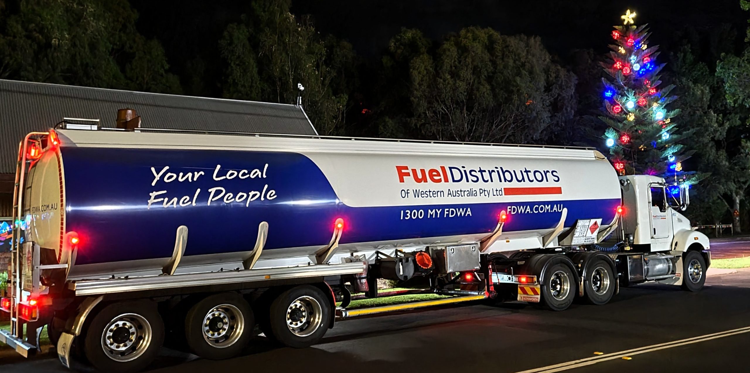 FDWA tanker at night time in front of a Christmas tree